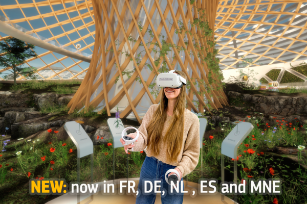Woman with head-mounted display and handheld controllers.