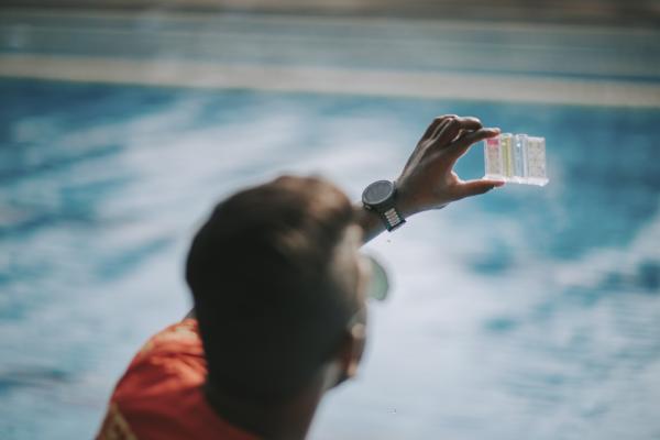 A testing kit being used in water