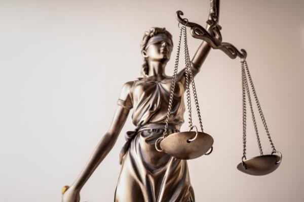 Legal rights concept image of a Statue of Lady Justice holding the scales of justice